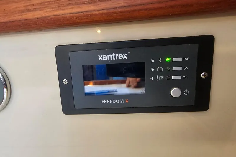Slide: The Image of Xantrex Freedom X control panel on 1988 Catalina 30 MkII yacht interior. - 23