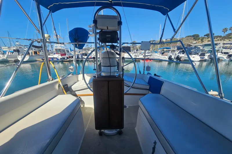 Slide: The Image of Cockpit view of a 1988 Catalina 30 MkII sailboat docked in a marina. - 5