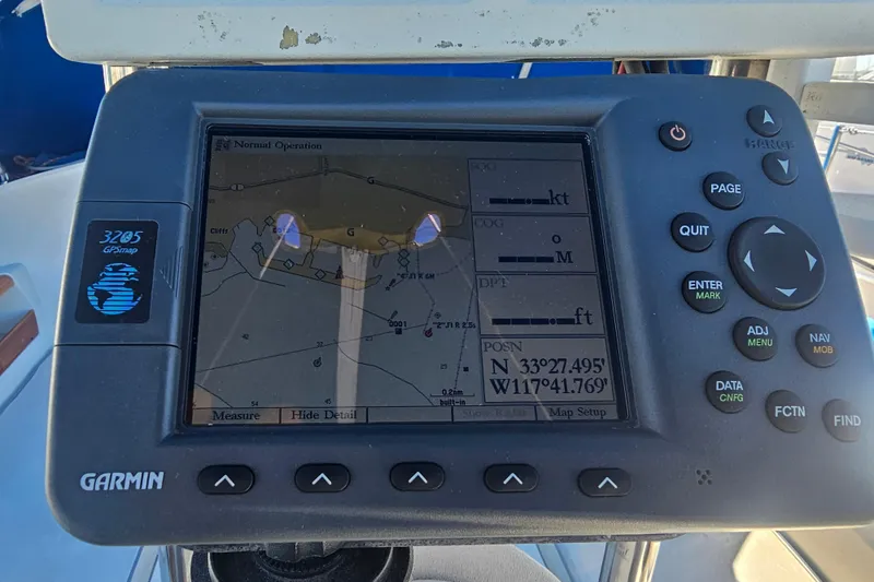 Slide: The Image of Garmin GPS device on 1988 Catalina 30 MkII sailboat displaying navigation coordinates. - 8