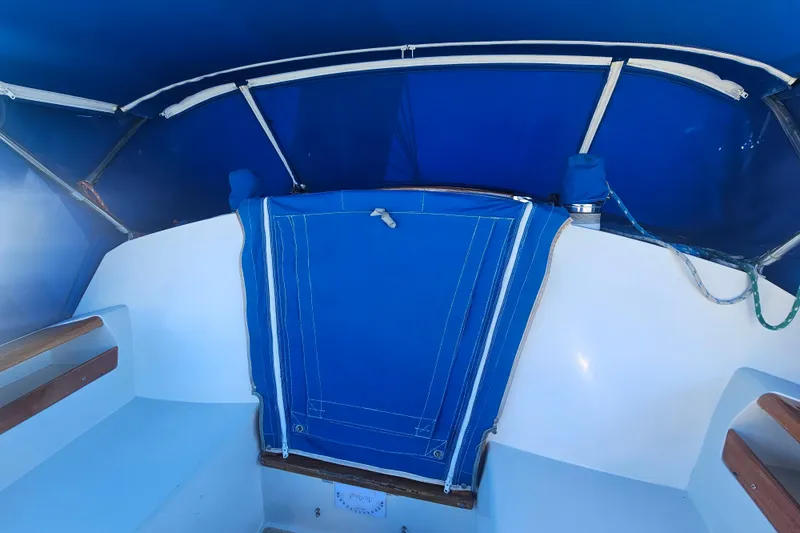 Slide: The Image of Interior view of a 1988 Catalina 30 MkII sailboat with blue canvas cover. - 9