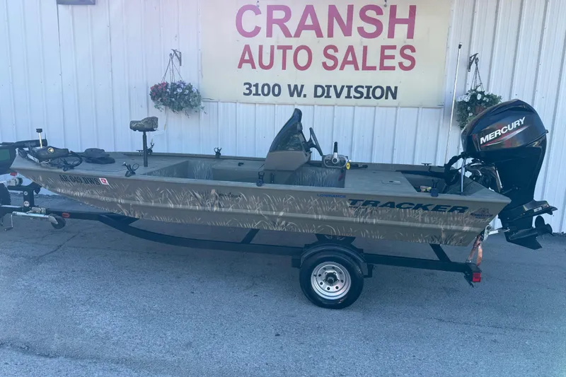 Slide: The Image of 2022 Tracker Grizzly 1648 SC boat at Cransh Auto Sales, featuring a Mercury engine. - 26
