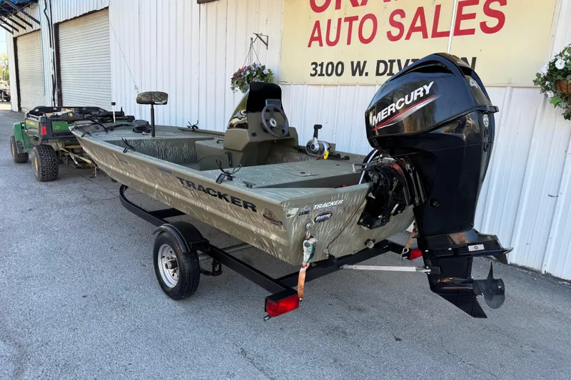 Slide: The Image of 2022 Tracker Grizzly 1648 SC boat with Mercury engine on trailer at auto sales lot. - 28