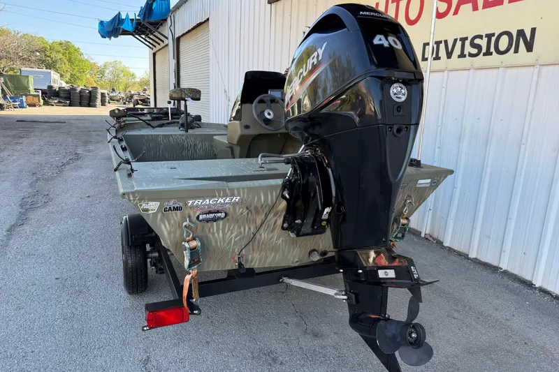 Slide: The Image of 2022 Tracker Grizzly 1648 SC boat with Mercury 40 engine, parked outside dealership. - 29