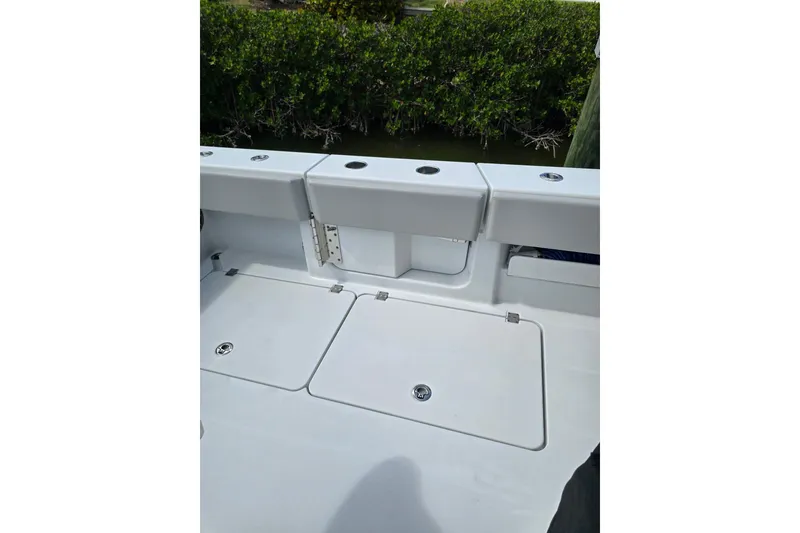 Slide: The Image of Freeman 47 boat deck, 2025 model, featuring storage compartments and sleek design. - 14