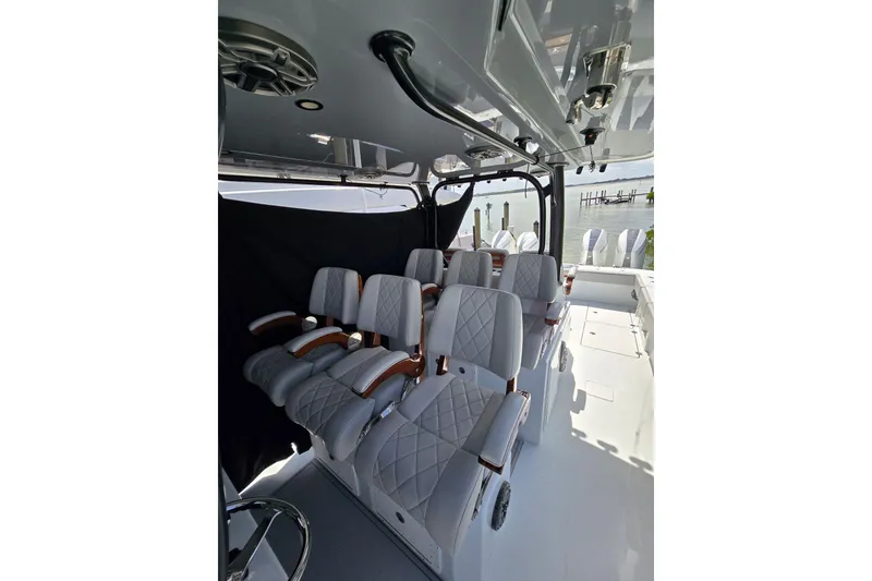 Slide: The Image of Luxurious seating on a 2025 Freeman 47 boat, featuring elegant white upholstery and sleek design. - 7