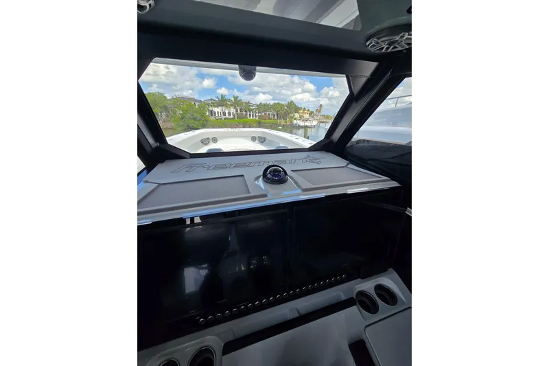 Slide: The Image of Interior view of 2025 Freeman 47 boat cockpit with scenic waterway. - 8