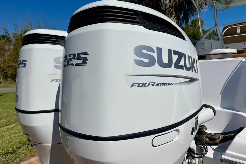 Slide: The Image of Twin Suzuki S225 four-stroke engines on a 2018 Pro-Line 26 Express boat. - 10