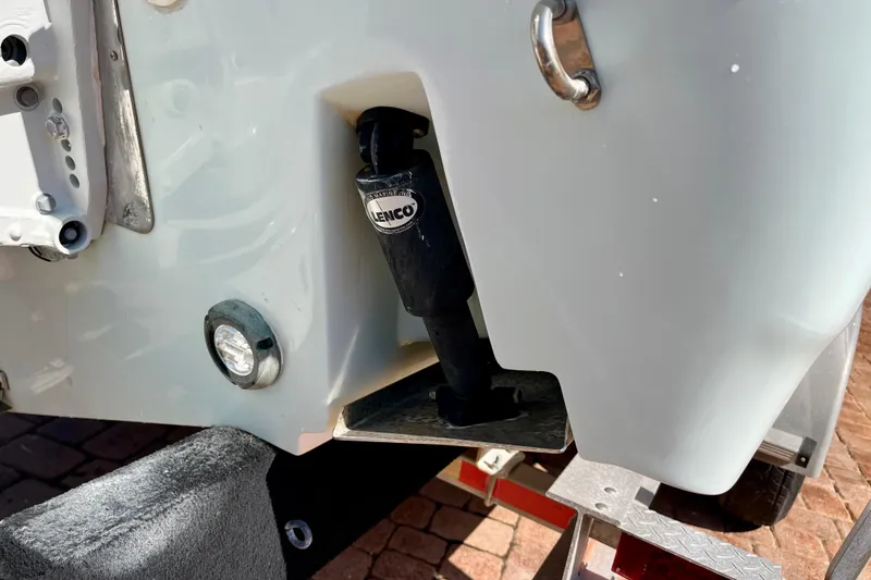 Slide: The Image of Close-up of 2018 Pro-Line 26 Express boat's Lenco trim tab actuator. - 12