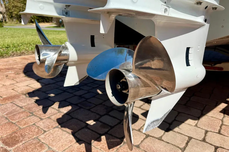 Slide: The Image of Close-up of dual propellers on a 2018 Pro-Line 26 Express boat. - 13