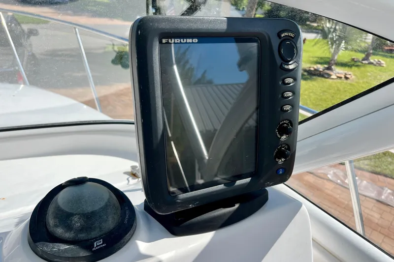 Slide: The Image of Furuno marine GPS system on 2018 Pro-Line 26 Express boat dashboard. - 16