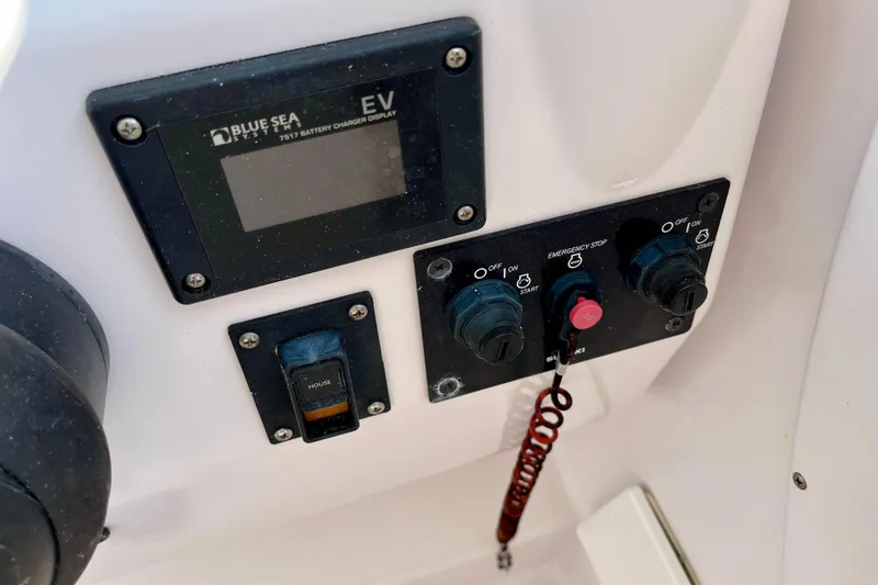 Slide: The Image of Control panel of a 2018 Pro-Line 26 Express boat with battery charger display. - 23