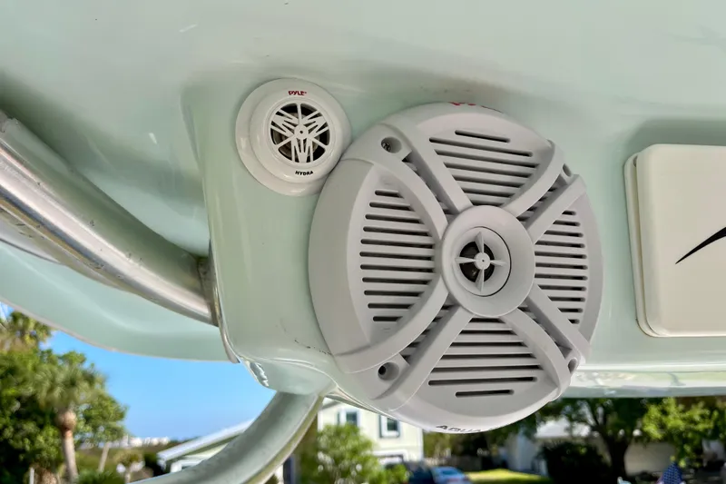 Slide: The Image of Speakers on a 2018 Pro-Line 26 Express boat, featuring Pyle Hydra audio system. - 26