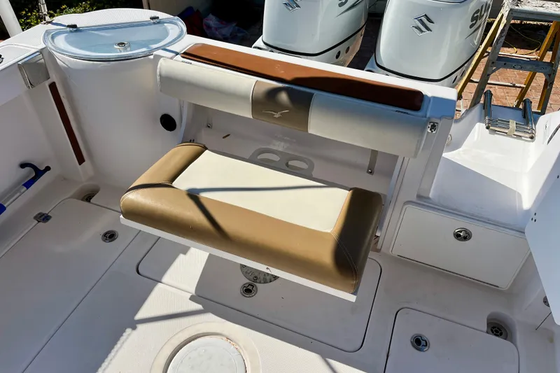 Slide: The Image of 2018 Pro-Line 26 Express boat interior with seating and dual Suzuki engines. - 40