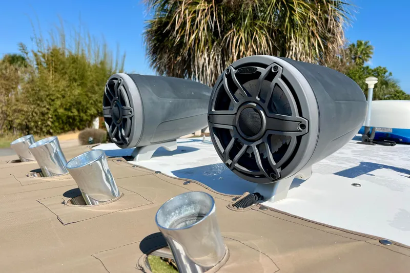 Slide: The Image of Speakers and rod holders on a 2018 Pro-Line 26 Express boat deck. - 50