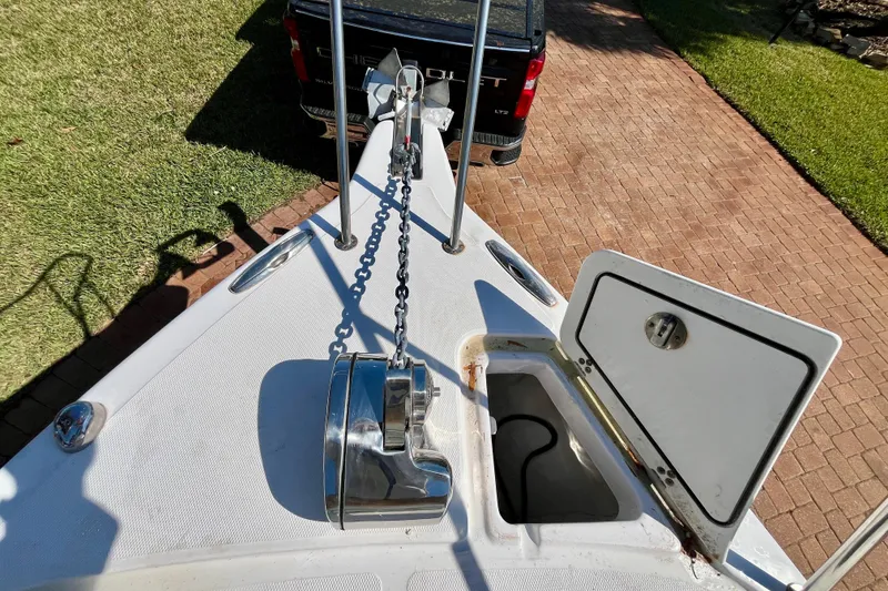 Slide: The Image of 2018 Pro-Line 26 Express boat bow with anchor chain and storage compartment. - 53