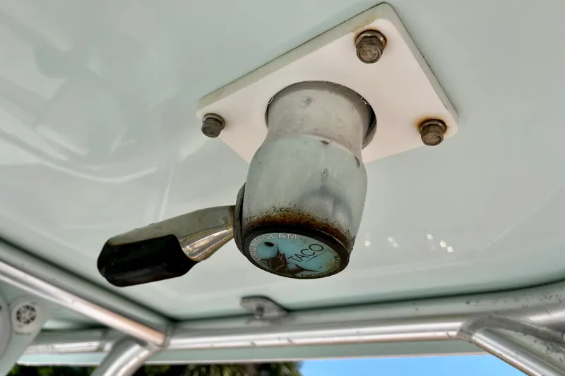 Slide: The Image of Close-up of a 2018 Pro-Line 26 Express boat's T-top mount with a Taco Grand Slam handle. - 61