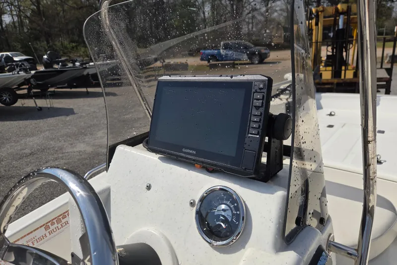 Slide: The Image of 2021 Mako Pro Skiff 15 CC dashboard with Garmin navigation system. - 11