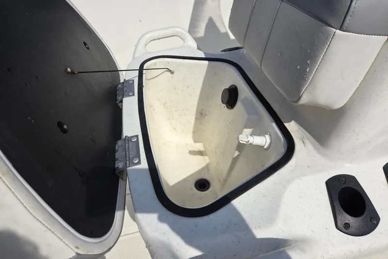 Slide: The Image of Open storage compartment on a 2021 Mako Pro Skiff 15 CC boat. - 17
