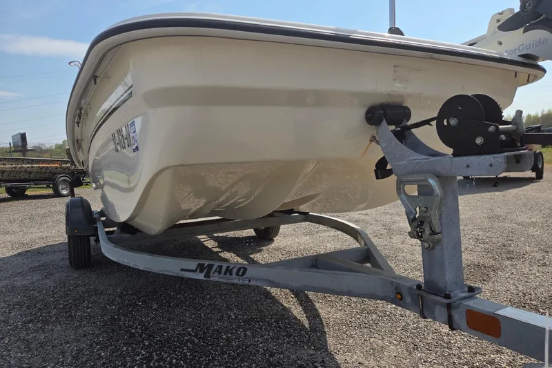 Slide: The Image of 2021 Mako Pro Skiff 15 CC boat on trailer, parked outdoors. - 3