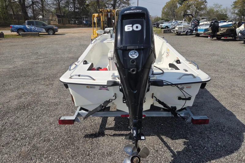 Slide: The Image of 2021 Mako Pro Skiff 15 CC with Mercury 60 engine on trailer in parking lot. - 6
