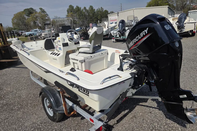 Slide: The Image of 2021 Mako Pro Skiff 15 CC boat with Mercury 60 engine on trailer. - 7