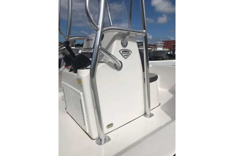 Slide: The Image of 2020 Tidewater 1910 Bay Max boat console with stainless steel railings under a blue sky. - 11