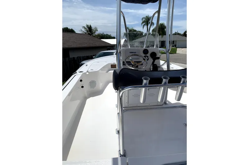 Slide: The Image of 2020 Tidewater 1910 Bay Max boat interior with steering console and rod holders. - 4