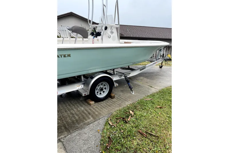 Slide: The Image of 2020 Tidewater 1910 Bay Max boat on trailer in driveway. - 5