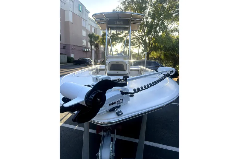 Slide: The Image of 2020 Tidewater 1910 Bay Max boat with Minn Kota trolling motor in a parking lot. - 8