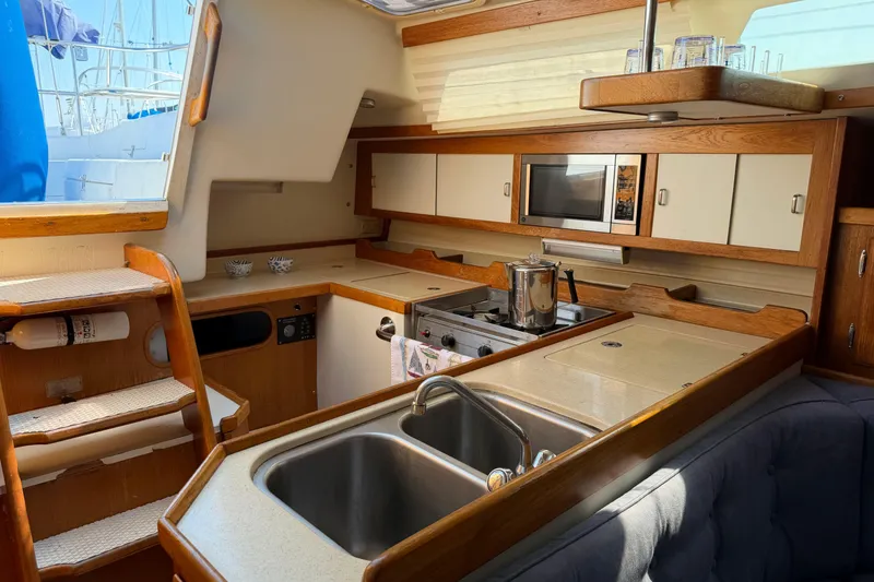Slide: The Image of Interior of a 1995 Catalina 36 MkII sailboat kitchen with sink and stove. - 18