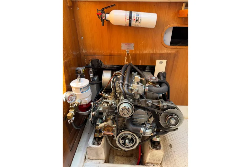 Slide: The Image of Engine compartment of a 1995 Catalina 36 MkII sailboat, featuring a well-maintained motor. - 31