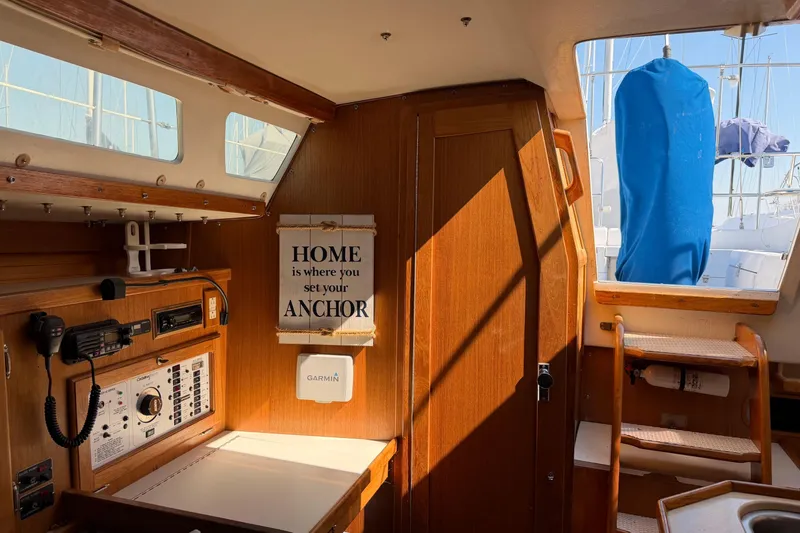 Slide: The Image of Interior of a 1995 Catalina 36 MkII sailboat with navigation equipment and inspirational sign. - 21