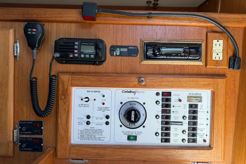 Slide: The Image of Control panel of a 1995 Catalina 36 MkII yacht with communication and electrical systems. - 22