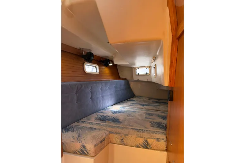 Slide: The Image of Cozy cabin interior of 1995 Catalina 36 MkII sailboat with cushioned seating. - 24
