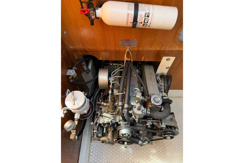 Slide: The Image of Engine compartment of a 1995 Catalina 36 MkII sailboat with visible fire extinguisher. - 34