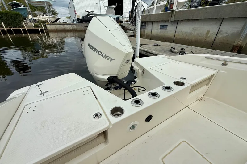 Slide: The Image of 2022 Boston Whaler 220 Dauntless boat with Mercury engine at dockside. - 19