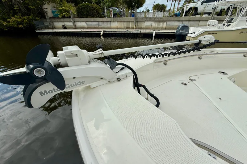 Slide: The Image of Boston Whaler 220 Dauntless 2022 with a MotoGuide trolling motor on deck. - 30