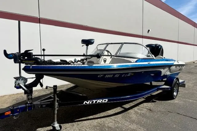 Slide: The Image of 2016 Nitro Z-7 Sport boat on trailer, parked outdoors near a building. - 10