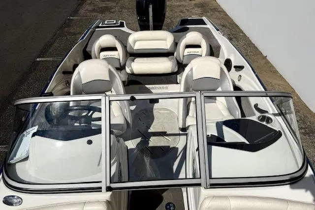 Slide: The Image of 2016 Nitro Z-7 Sport boat interior with white seating and windshield. - 12