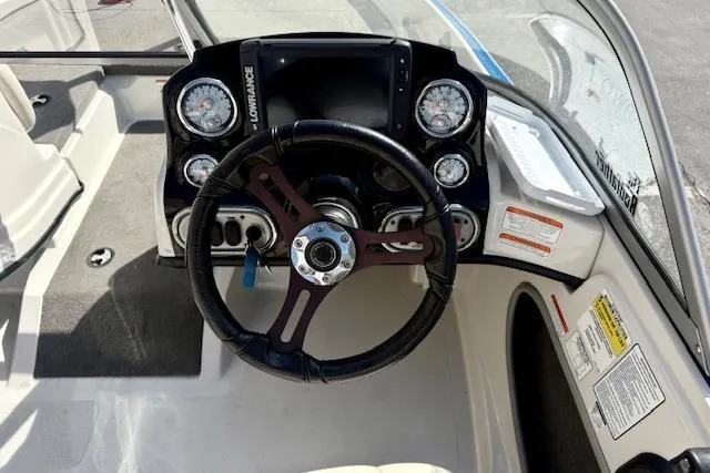 Slide: The Image of Steering console of a 2016 Nitro Z-7 Sport boat with gauges and controls. - 13