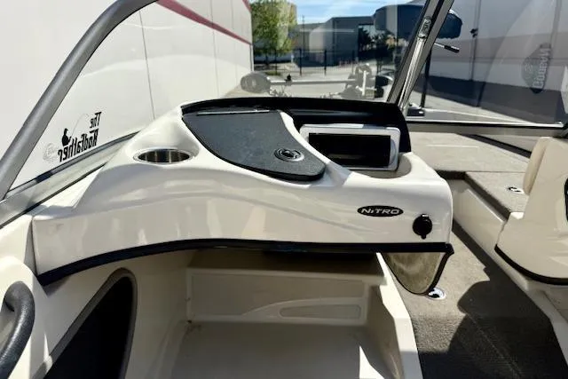 Slide: The Image of 2016 Nitro Z-7 Sport boat interior with steering console and seating area. - 18