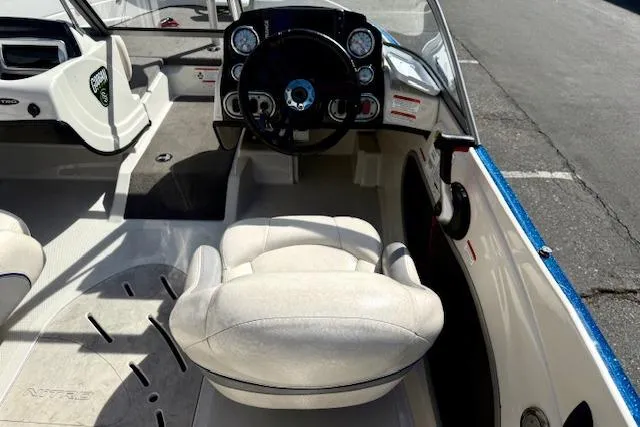 Slide: The Image of 2016 Nitro Z-7 Sport boat interior with steering wheel and seating. - 20