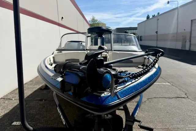 Slide: The Image of 2016 Nitro Z-7 Sport boat parked outdoors, featuring a sleek blue design. - 3