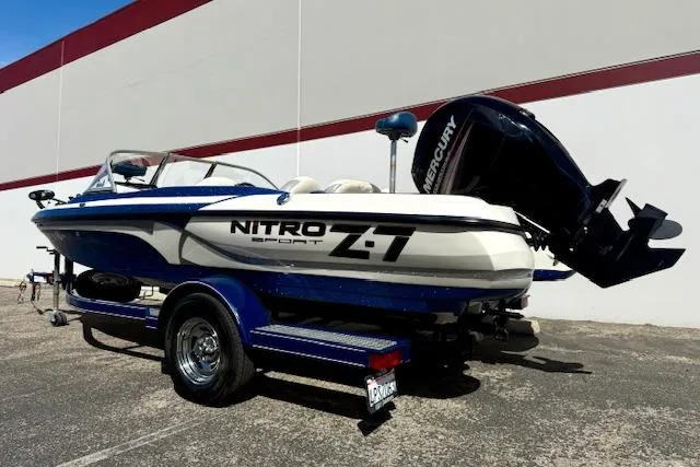 Slide: The Image of 2016 Nitro Z-7 Sport boat with Mercury engine, parked outdoors on a trailer. - 5