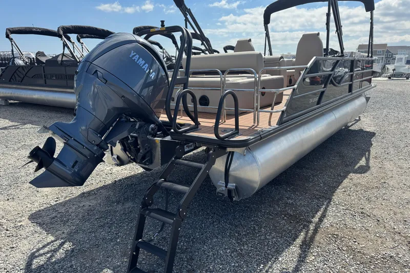 Slide: The Image of 2026 Bentley Pontoons Legacy 243 Swingback with Yamaha outboard motor, displayed on gravel lot. - 11