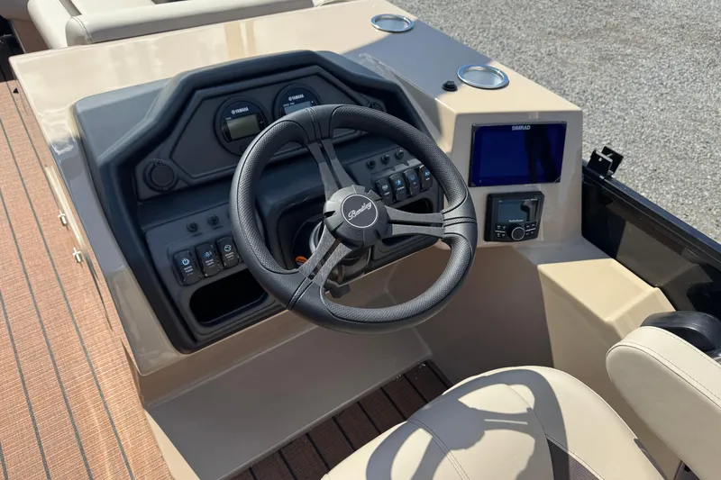 Slide: The Image of 2026 Bentley Pontoons Legacy 243 Swingback dashboard with steering wheel and controls. - 18