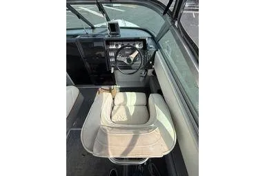 Slide: The Image of Interior of 1989 Cobalt Condurre 243 boat with steering wheel and seating. - 6