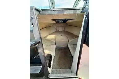 Slide: The Image of 1989 Cobalt Condurre 243 cabin interior with beige seating and modern design. - 7