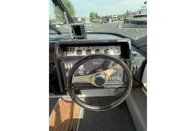 Slide: The Image of 1989 Cobalt Condurre 243 dashboard with steering wheel and instrument panel. - 8