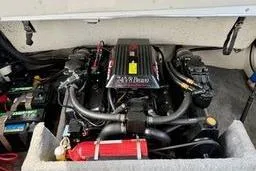 Slide: The Image of 1989 Cobalt Condurre 243 engine compartment with visible components and fire extinguisher. - 9